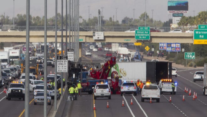 Emergency personnel respond to a crash on Interstate 10 north of Ray Road in Chandler on Dec. 7, 2016.