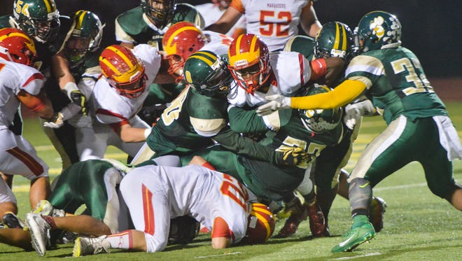 The Melbourne Central Catholic defense stops Clearwater Central Catholic from scoring on a fourth down during the second quarter.