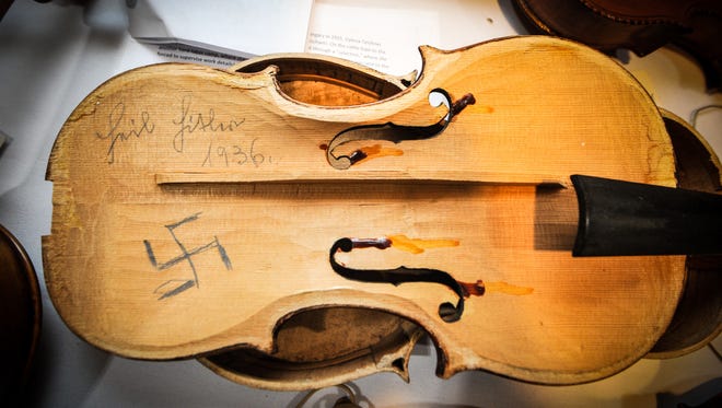 A violin whose interior was parted in the 1930s with "Heil Hitler" and with a swastika is part of the "Violins of Hope" but will not be restored.