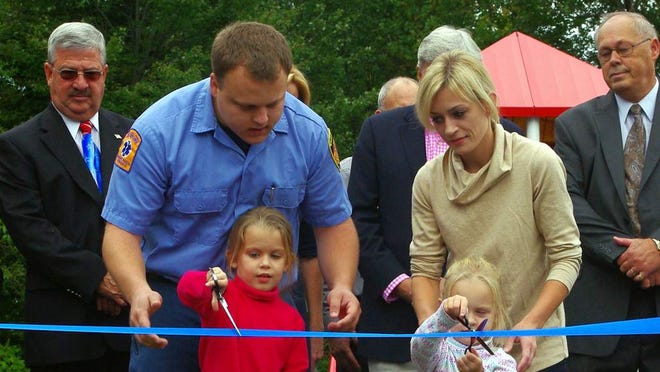 Chip's daughters were given the honor of cutting the ribbon