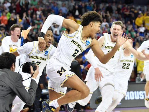 Michigan Wolverines guard Jordan Poole (2) celebrates