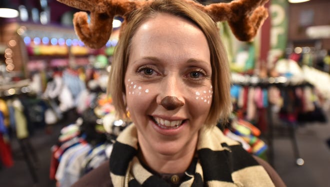 Terri Hull, new owner of Sippees Used & New Kids Clothes. Hull dressed as a reindeer for Black Friday.