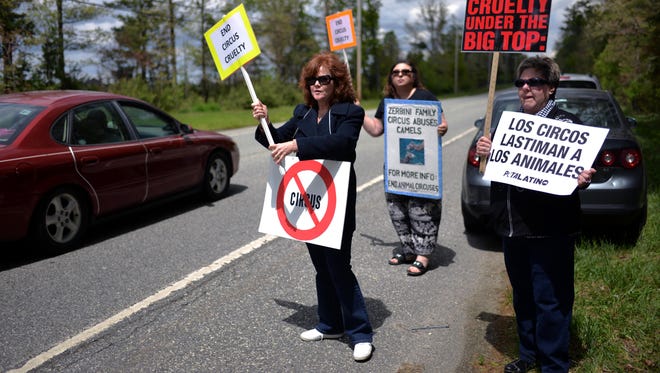 Lisa Morse-Morrison, of Port Norris, Gabrielle Carleen, of Manahawkin, and Adrienne Possenti, of Vineland (from left), protest the Zerbini Family Circus outside New Jersey Motor Sports Park Sunday, May 15 in Millville.
