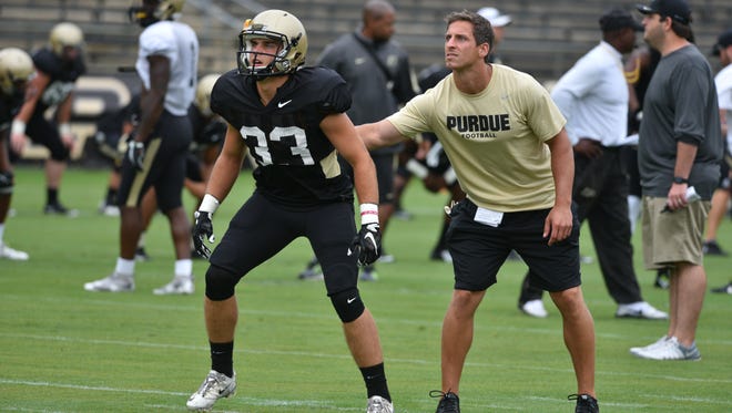 Purdue freshman Jackson Anthrop (33) warms up for the jersey scrimmage with graduate assistant JMichael Jonard on Aug. 13, 2016 at Ross-Ade Stadium.