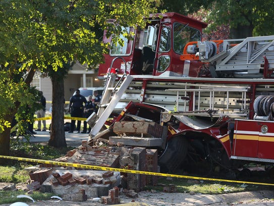 Investigators work the scene of an apparent crash between