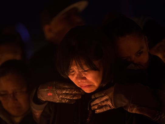 Theodora Hayes the mother of Mitchual Sam and Hjordis Sam mourns the loss of her children during a candlelight vigil on Friday 2017 in Kirtland.