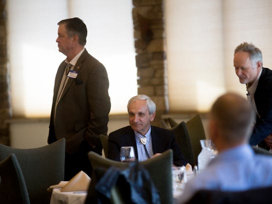 At center, Ken McQueen, cabinet secretary of the New