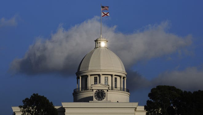 The sun reflects off of a window over the dome of the State capitol Building in downtown Montgomery, Ala. on Monday November 17, 2014.