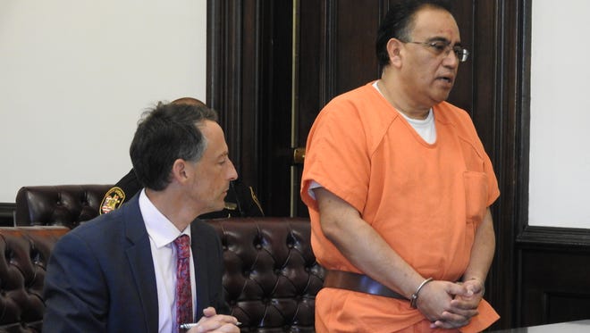 Attorney Lawrence Levinson listens his client, David A. Velasquez, address Judge Robert Batchelor Thursday in Coshocton County Common Pleas Court. Velasquez received 180 days in prison for violating terms of his probation for charges of permitting drug abuse and trafficking in drugs.