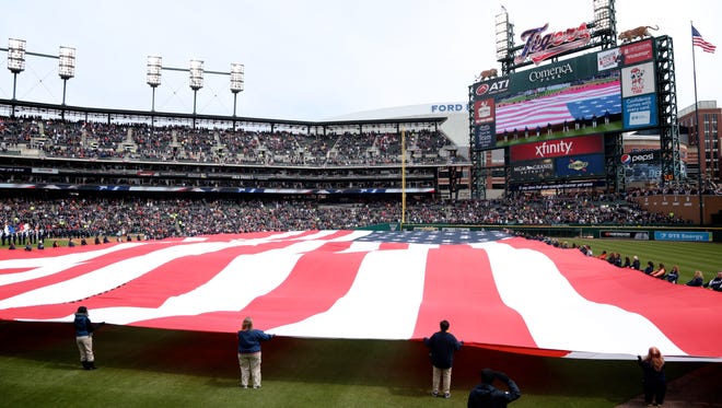 The national anthem before Detroit Tigers play against the New York Yankees during opening day at Comerica Park in downtown Detroit, on Friday, April 8, 2016. 