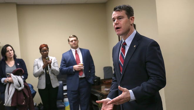 At right, Senator Todd Young talks during an open house to welcome Hoosiers visiting D.C. for the presidential inauguration, at the Russell Senate Office Building in Washington D.C., Thursday, Jan. 19, 2017. 