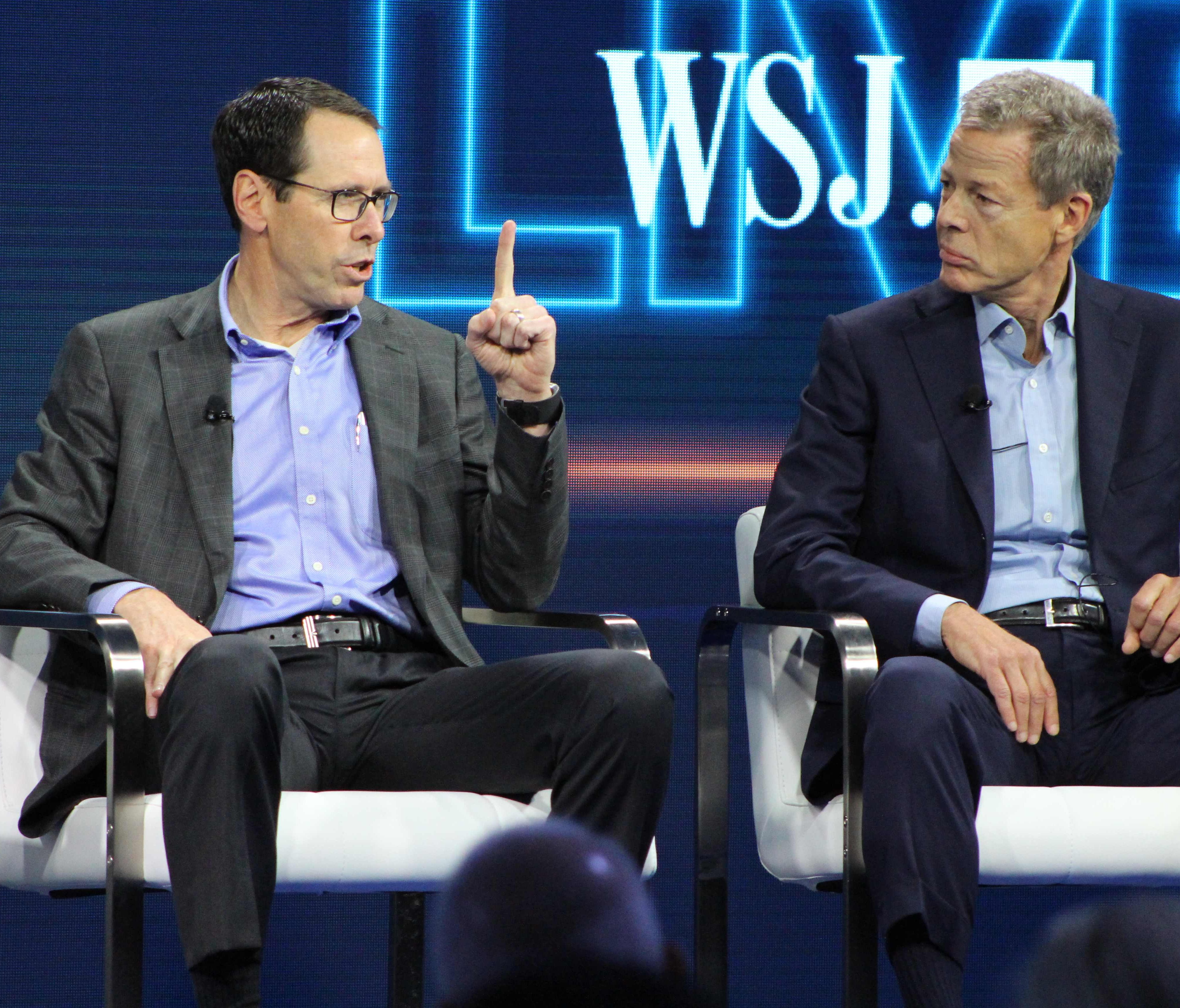 AT&T chief executive Randall Stephenson, left,  and Time Warner chief executive Jeffrey Bewkes defend the proposed mega-merger of the companies at a WSJD Live technology conference in Laguna Beach, Calif., on Oct. 25, 2016.