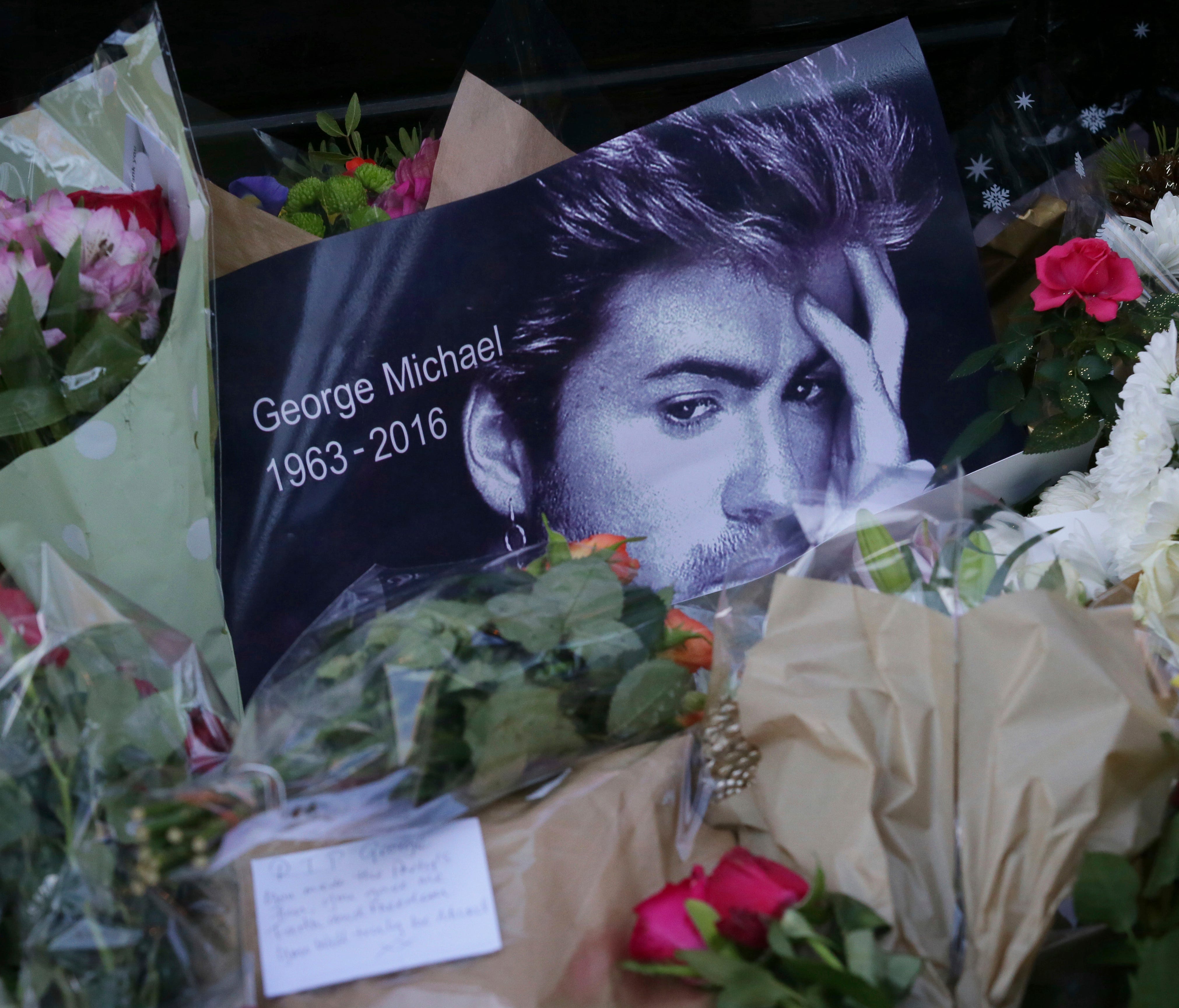 Tributes have been left outside the home of British musician George Michael in London.
