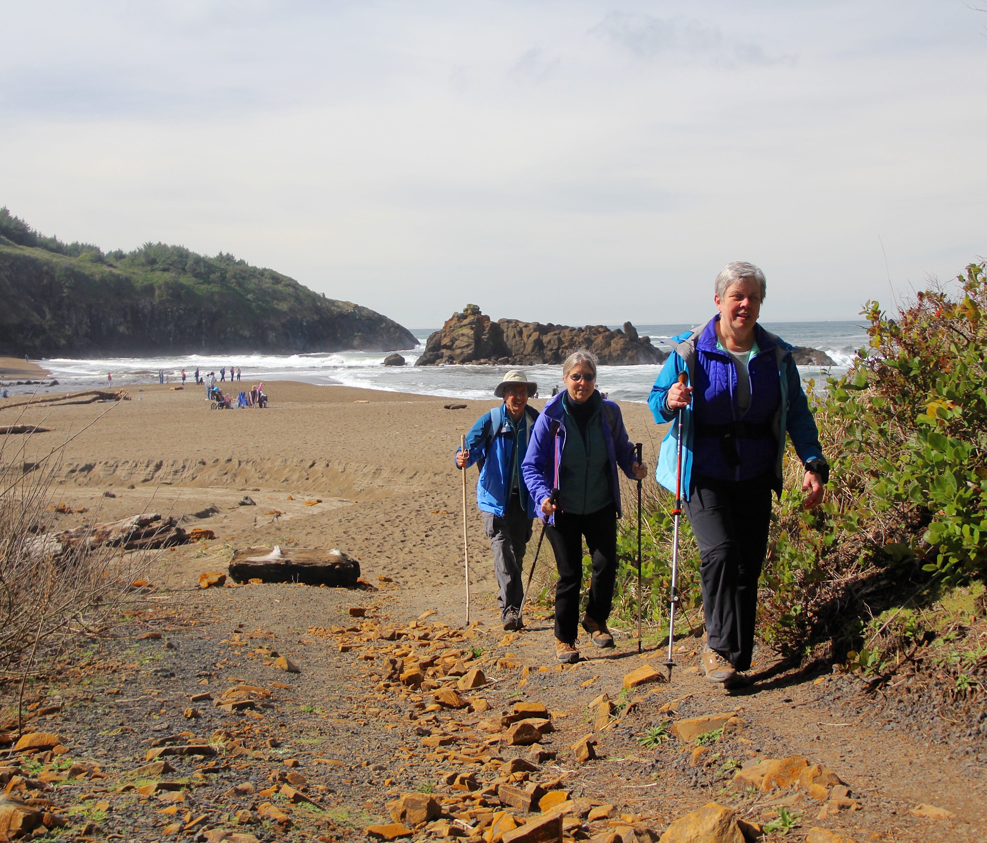 Connie Soper, front, and Dan and Lucy Hilburn are advocates for connecting the Oregon Coast Trail.