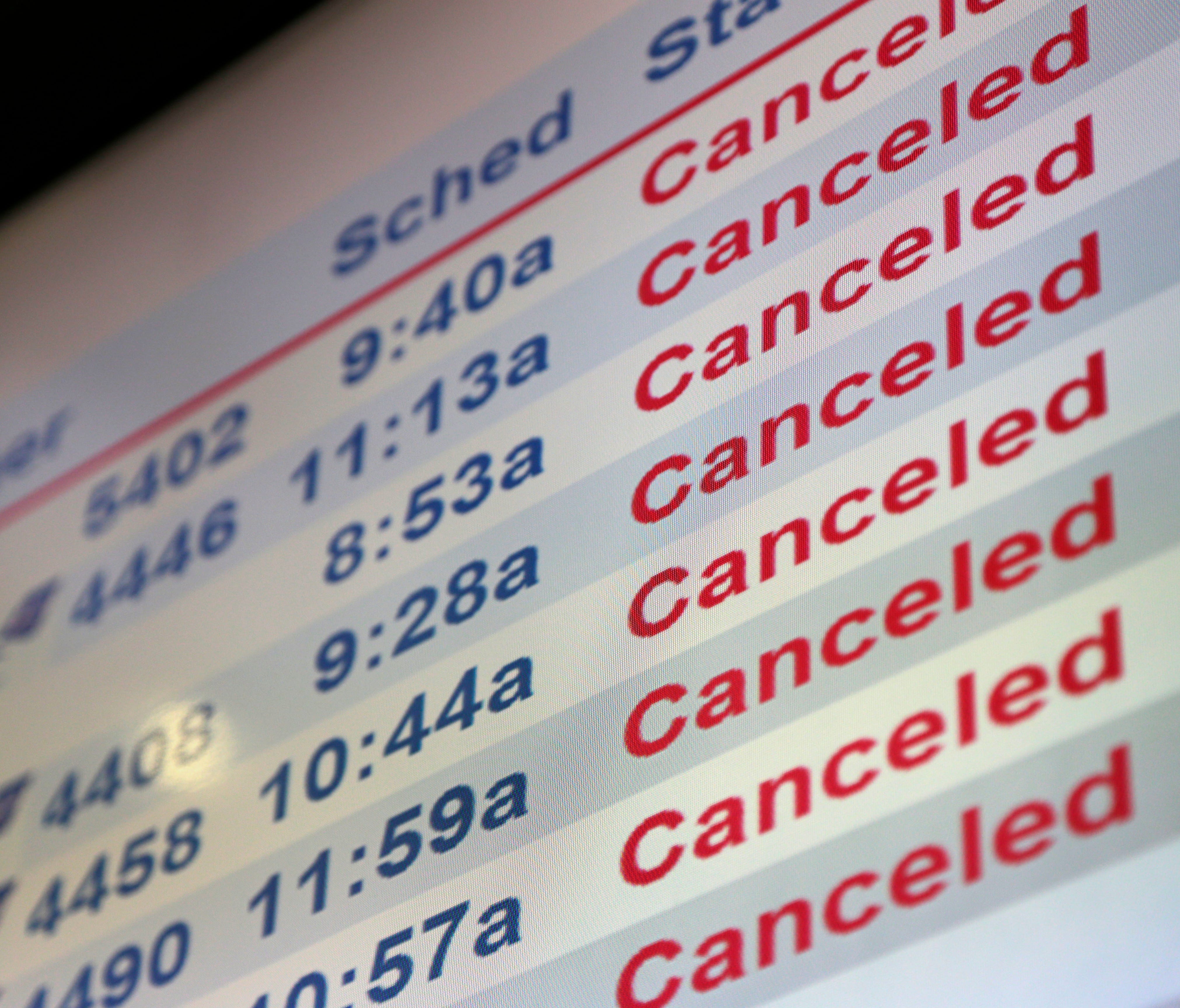 Screens display canceled flights at Newark Liberty International Airport on Tuesday, March 14, 2017.