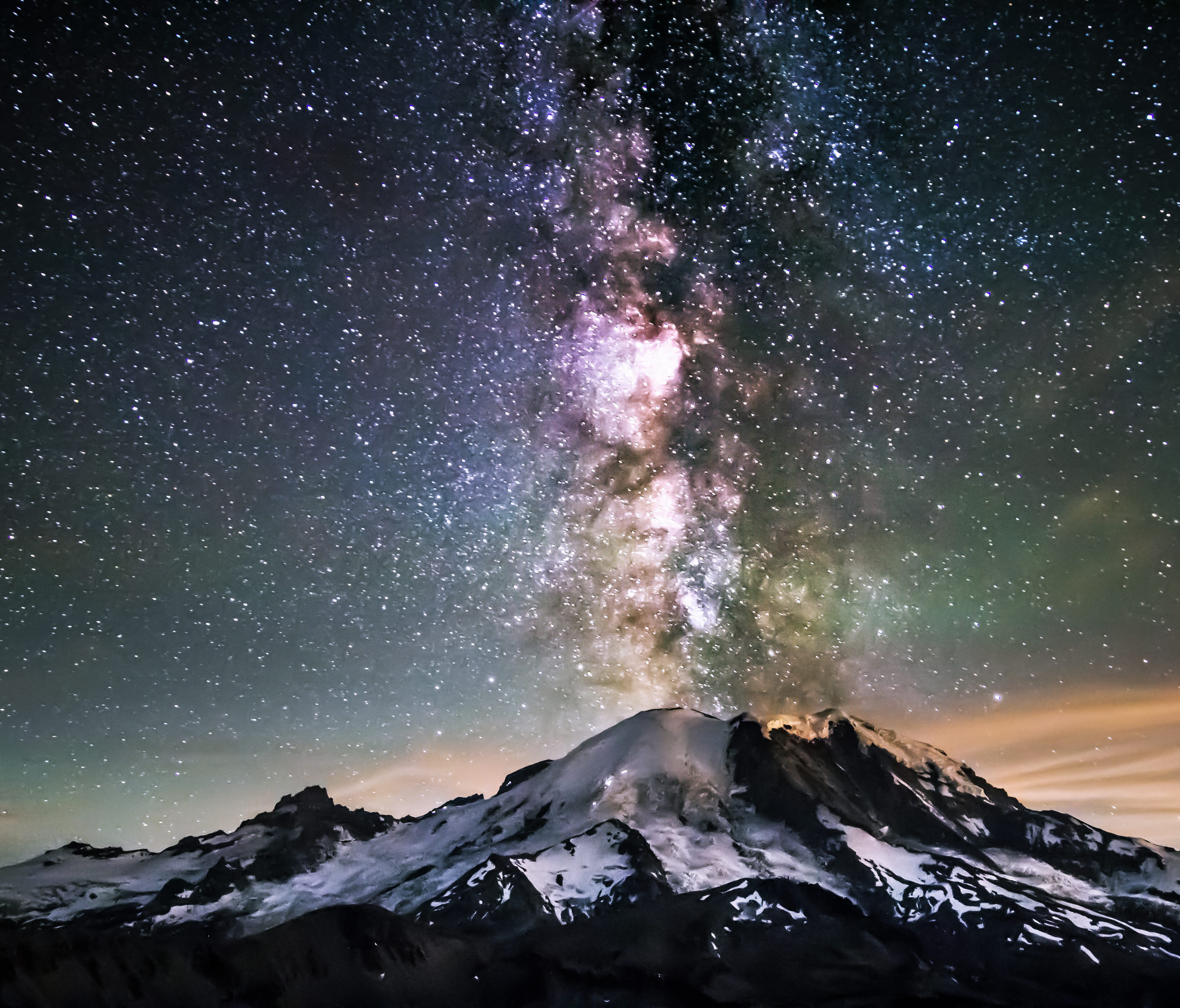 Mount Rainier National Park's majestic peak towers over 14,000 feet tall and contains 25 named glaciers. During the summer months this Washington park turns into a rainbow of colors, filled with valleys overflowing with colorful wildflowers. Pictured