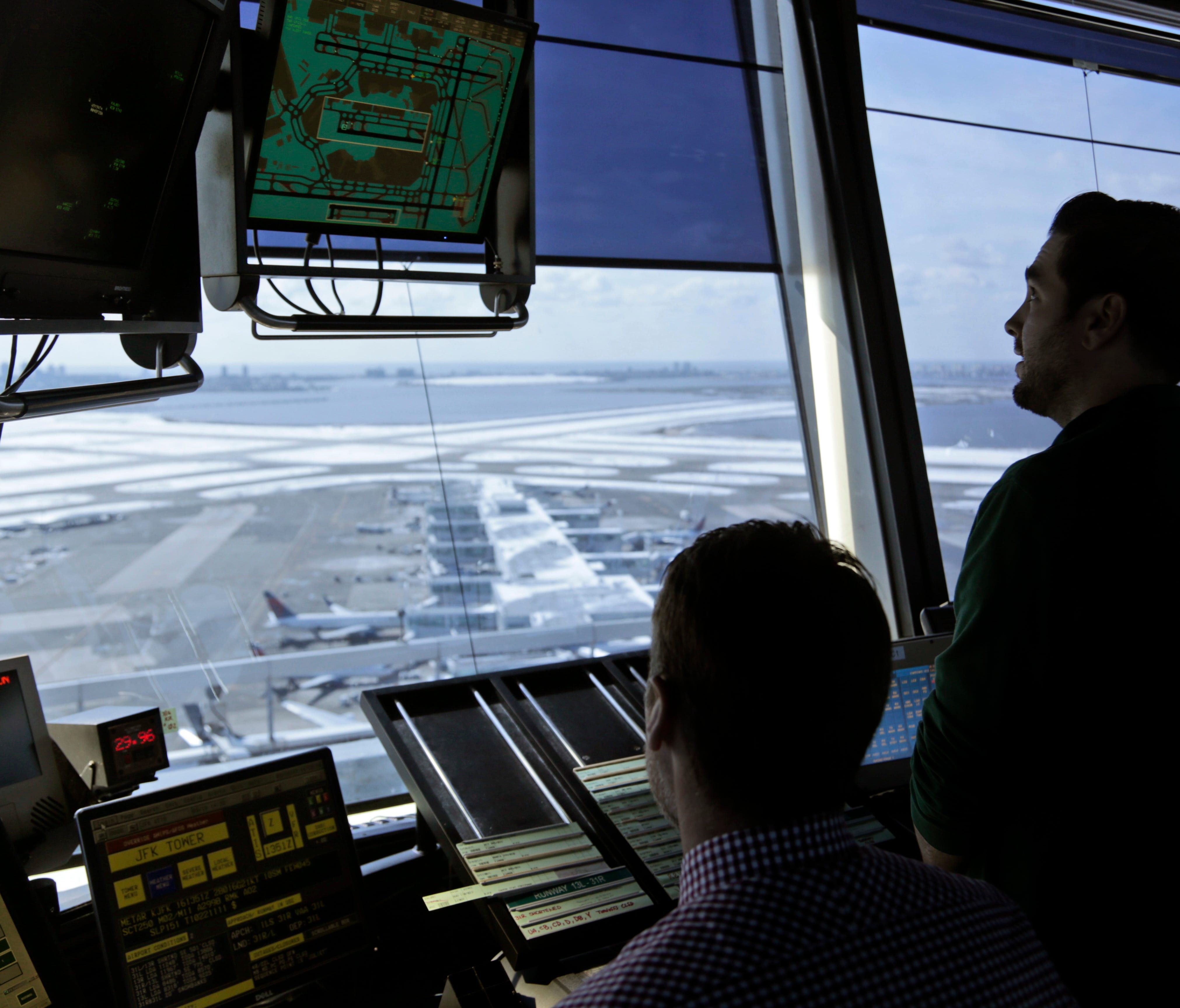 Air traffic controllers work in the tower at John F. Kennedy International Airport in New York on March 16, 2017.