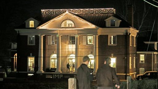FILE - Students participating in rush pass by the Phi Kappa Psi house at the University of Virginia in Charlottesville, Va., in this Jan. 15, 2015 file photo. Now the Columbia Graduate School of Journalism is about to explain how it all went so wrong. The school's analysis of the editorial process that led to the November 2014 publication of "A Rape on Campus" will be released online at 8 p.m. EDT Sunday April 5, 2015. (AP Photo/Steve Helber, File)