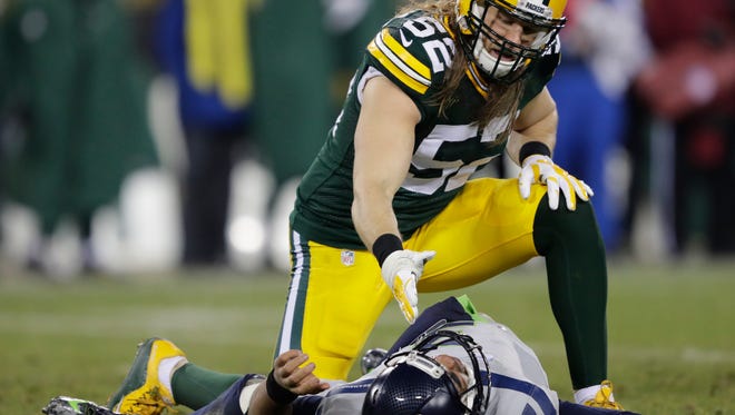 Green Bay Packers' Clay Matthews offers a helping hand to Seattle Seahawks' Russell Wilson after knocking him to the ground in the fourth quarter.
The Green Bay Packers host the Seattle Seahawks Sunday, December 11, 2016, at Lambeau Field in Green Bay, Wis.