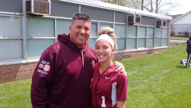 Bloomfield pitcher Lexi Corio, here with her dad Joe during a game last spring, has continued to improve for the Bengals' softball team this summer.