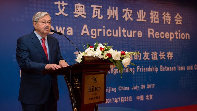Iowa's former governor, Terry Branstad, now the U.S. ambassador to China, talks with Iowa soybean growers.