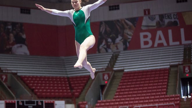 Kierstyn Cochran with New Castle competes on the balance beam at the 45th annual IHSAA Gymnastics State Finals on March 11 at Worthen Arena.