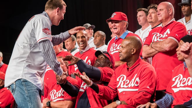 Third baseman Todd Frazier receives a warm welcome from Reds players, past and present, during Redsfest in December.