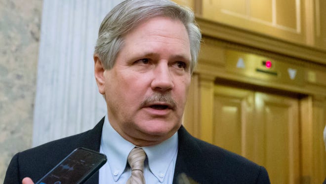 U.S. Sen. John Hoeven, R-N.D. speaks to reporters on Capitol Hill in Washington. Congressional committees and farm groups have crafted language to fix a provision in the federal tax overhaul that gave an unintended tax advantage to farmers who sell their crops to cooperatives instead of other buyers.