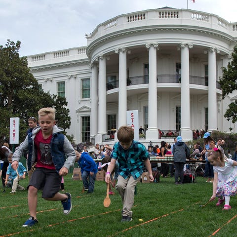 Children participate in the egg roll during the Wh