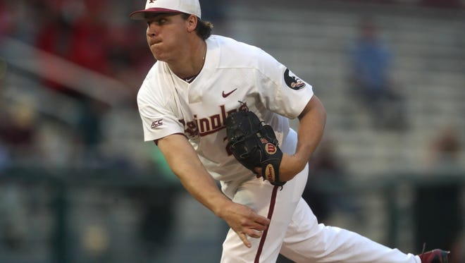 FSU’s Cole Sands pitches against Louisville during the Seminoles’ 9-4 win at Dick Howser Stadium on Thursday. 