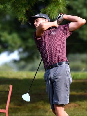 John Glenn's Chase Karling watches a tee shot during his team's match against Morgan on Tuesday at Wildfire.