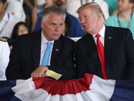 Virginia Gov. Terry McAuliffe, left, with President