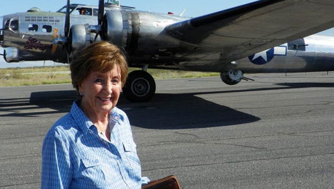 Rosemary "Rusty" Windham, here at a recent visit to the War Eagles Air Museum in Santa Teresa, recalls her "Rosie the Riveter" days. The B-17 bomber behind her, she said, "might be one I worked on during World War II."