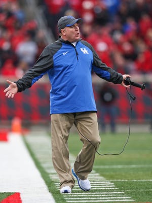Kentucky's Mark Stoops reacts to a call during the game against Louisville. Nov. 29, 2014 By Matt Stone/The C-J