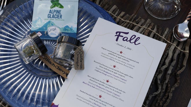 A menu shows food and marijuana pairings during a dinner at Planet Bluegrass, an outdoor venue in Lyons, Colo. Associated Press