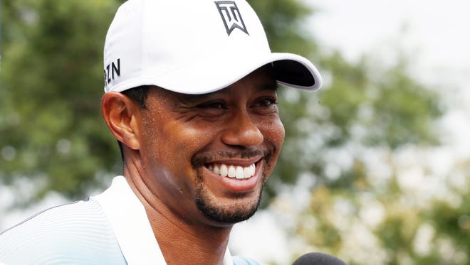PGA golfer Tiger Woods speaks at a press conference after playing 9 holes during practice for the 2014 PGA Championship at Valhalla Country Club in Louisville, Ky., on Aug. 6.