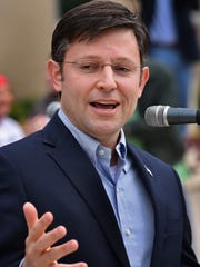 U.S. Rep. Mike Johnson speaks to a crowd of several