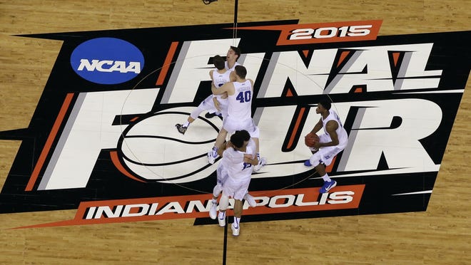 Duke players celebrate after the NCAA Final Four college basketball tournament championship game against Wisconsin  Monday, April 6, 2015, in Indianapolis. Duke won 68-63.