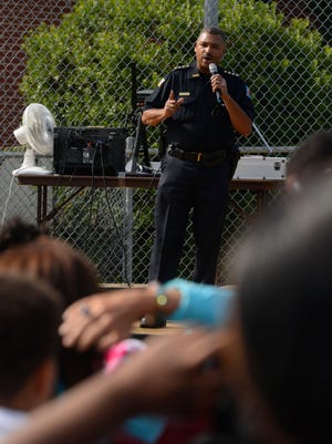 FILE - Chief of Police David Alexander speaks to the crowd during the Pensacola Community Arts & Recreation Association's Community Cookout at the Fricker Center.