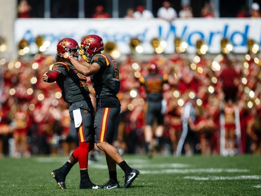 Iowa State's Jacob Park, left, and Allen Lazard, right,