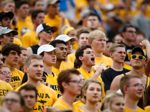 Iowa fans react to a call during their football game