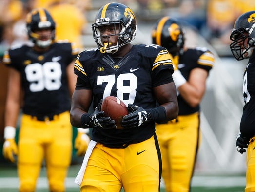 Iowa's James Daniels (78) warms up before taking on
