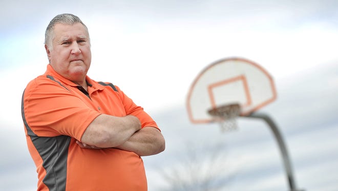 "The truth sometimes hurts, so you didn't tell the truth as a recruiter. You lied. ' Trust me, I'm lying ' was almost my motto." said Al Hmiel, former college assistant basketball coach at the University of Cincinnati, seen here posing on a basketball court near his York, Pa. home on Wednesday, Nov. 11, 2015.