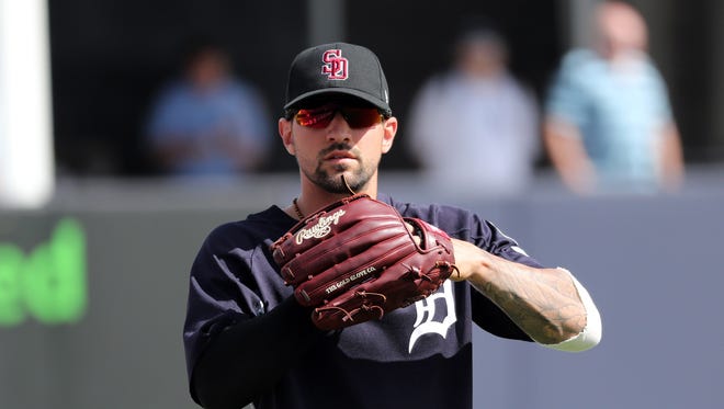 Tigers right fielder Nick Castellanos (9) works out as he wears the cap of the Marjory Stoneman Douglas High School baseball team, the Stoneman Douglas Eagles, before the exhibition game at George M. Steinbrenner Field on Friday, Feb. 23, 2018, to honor the victims of Feb. 14's attack in Parkland, Fla.