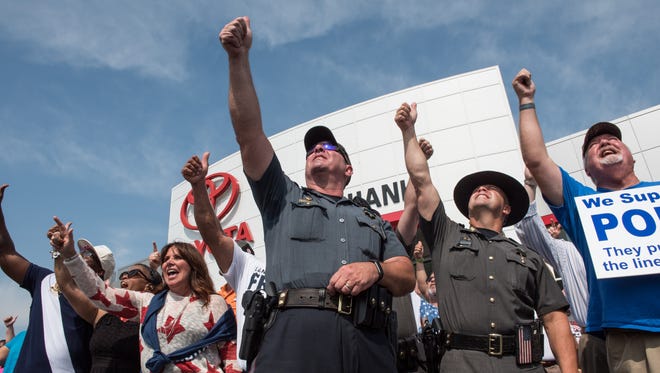 Rally calls for police, community to join amid violence