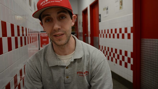 Anthony Dion, at the Five Guys where he's a manager, on March 2, 2016. Dion previously served three years in prison, after which he struggled to find a job. His aunt, Rep. Jean O"Sullivan of Burlington, has sponsored a bill to help give people with criminal convictions a second chance.