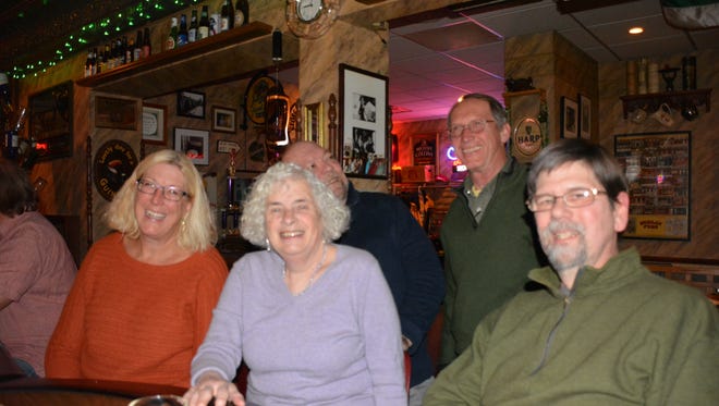 Mary Dobbins (center) with supporters at The Cork restaurant in Kewaunee Tuesday night.t