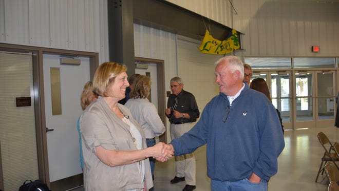 (Left) Tinka Hyde, EPA director of water for Region V, talks with Dick Swanson, a member of the DNR workgroups. She said that the EPA was committed to remaining in Kewaunee County until its groundwater problems were addressed.