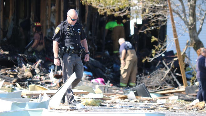 Authorities process the scene of a home explosion along East Harbor Road in Port Clinton in October 2016.