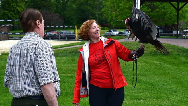 Lee Yeash of Woodford Cedar Run in Medford shows off a turkey vulture, Apollo, at last year's event.